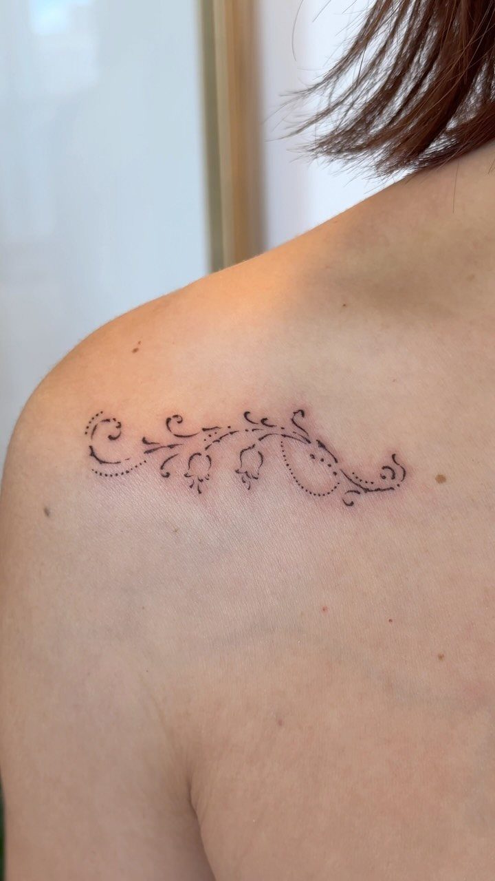 14 Places for a Tattoo for Women: From Ankle to Neck 5 Fine line floral bell tattoo on a woman's collarbone skin.