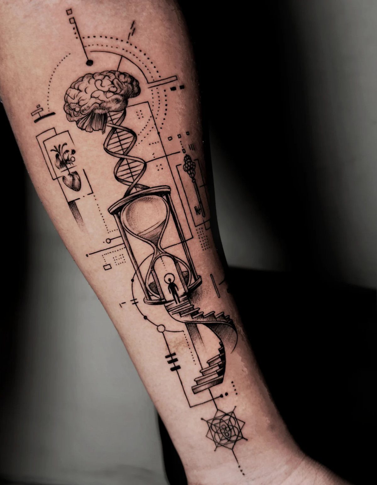 17 Tattoo Pattern on Arm Ideas: From Fine Line to Full Sleeve 2 Fine line black and grey tattoo on a forearm featuring a brain, DNA, and an hourglass.