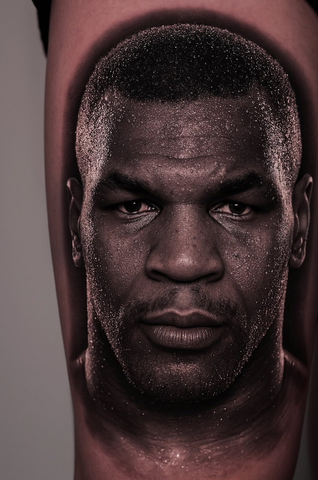 High Contrast Tattoo Design: 8 Bold Ideas That Read From Any Distance 6 A high-contrast portrait tattoo of a man's face with detailed black shading on skin.