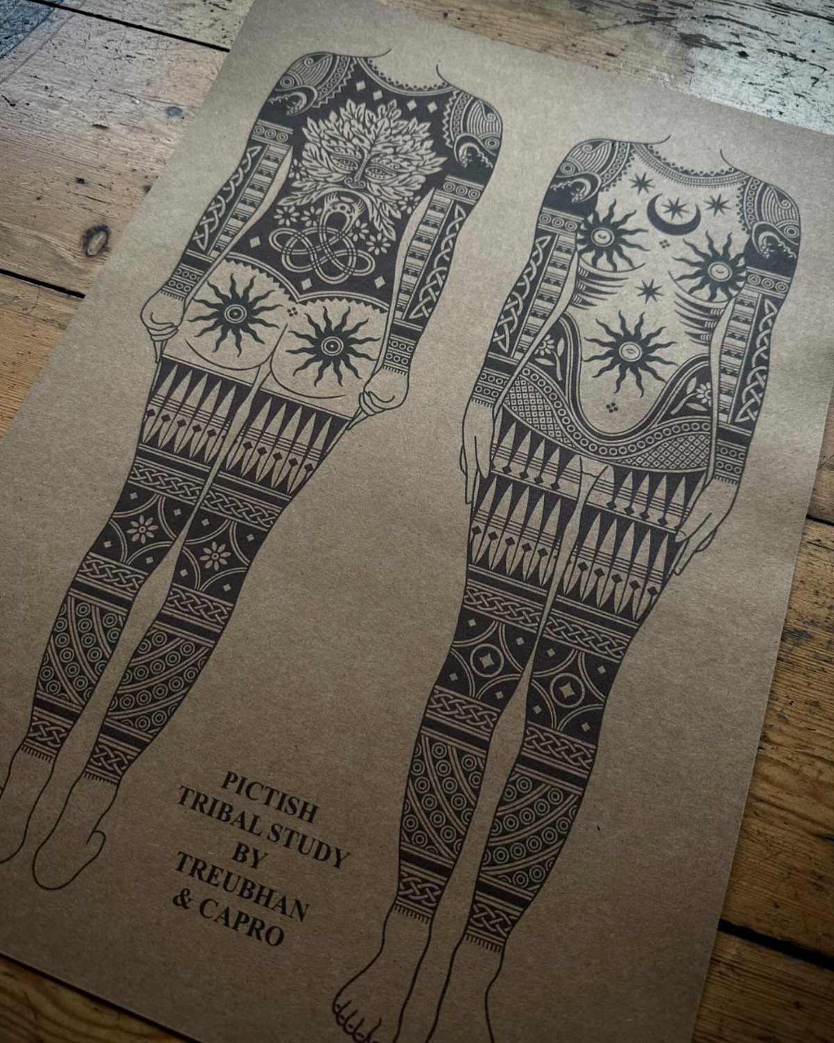 Celtic Pagan Tattoo: 6 Design Ideas and Flash Art 6 Two line drawings of female bodies decorated with intricate black ink Pictish tribal patterns on brown paper.