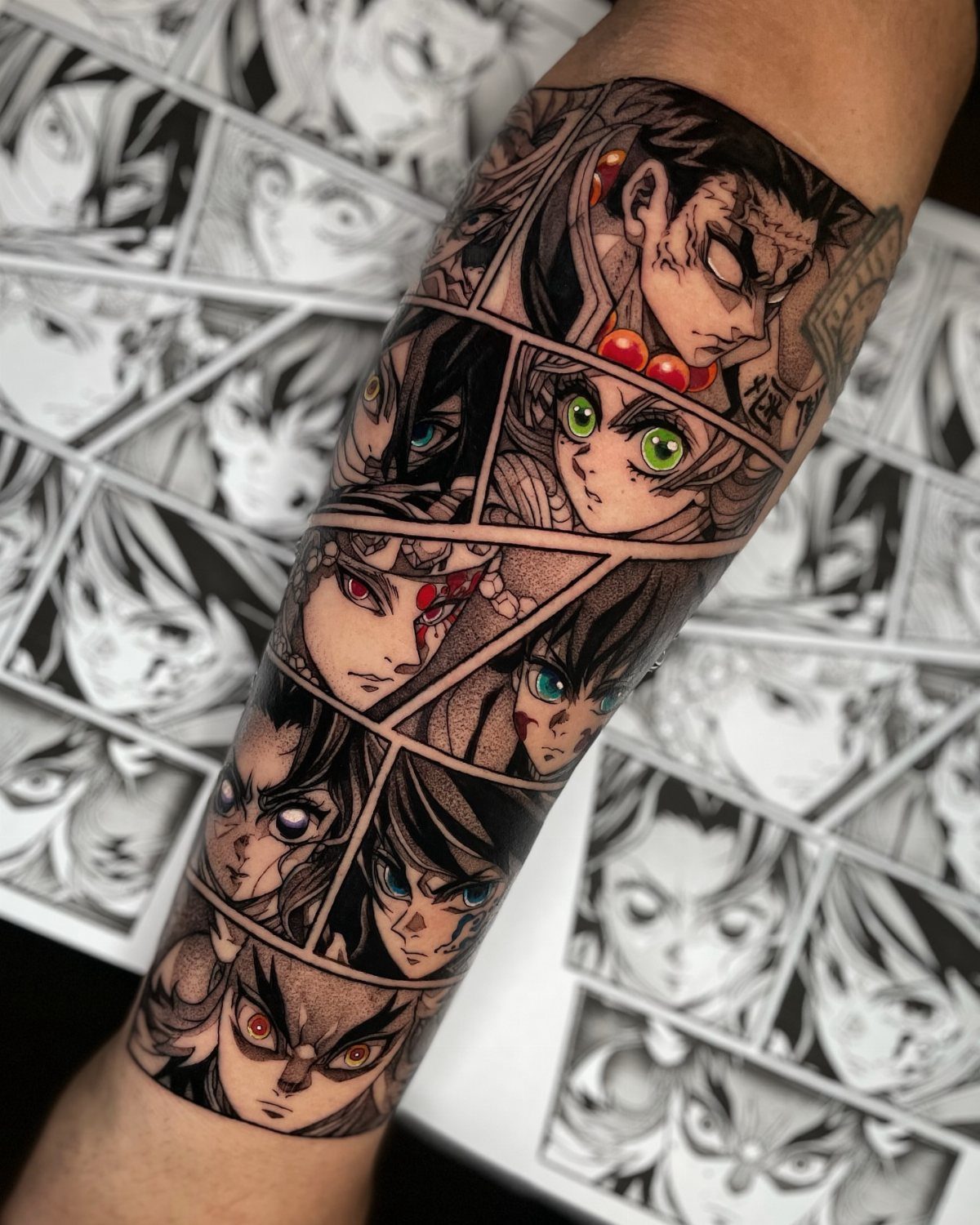 Anime character face tattoos arranged in manga panels on a person's forearm.